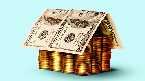 Refinance house made of stacked coins and dollar bills